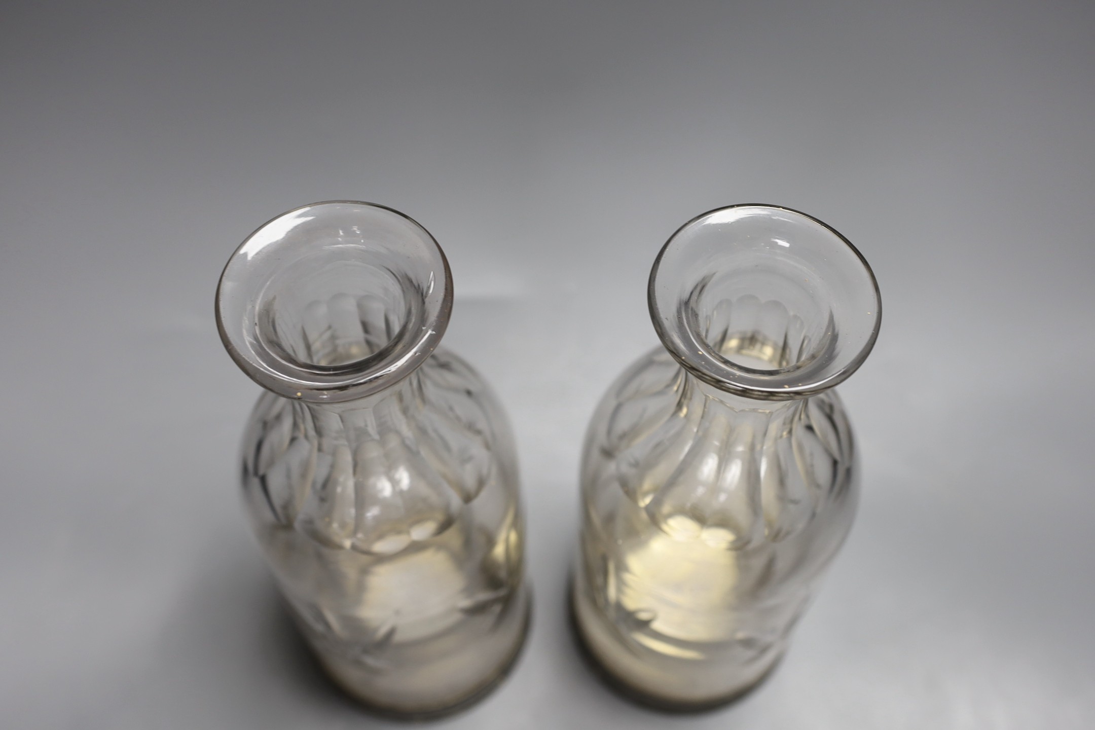 A pair of French glass carafes with silver plated bases and integral ice compartment 28cm